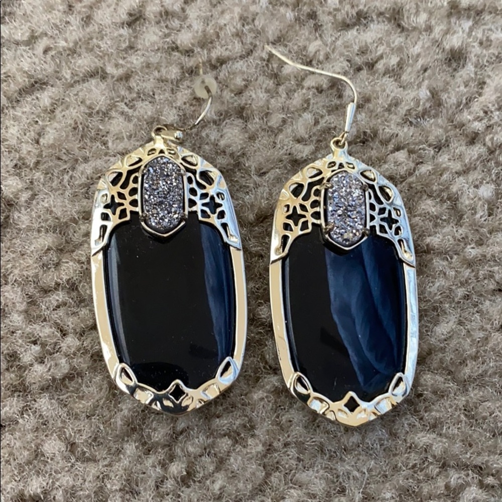 Black and gold Kendra Scott earrings.